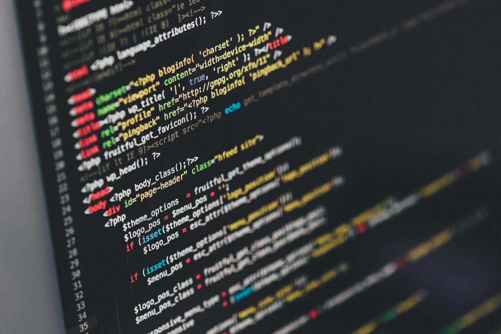 Developer writing code on a laptop